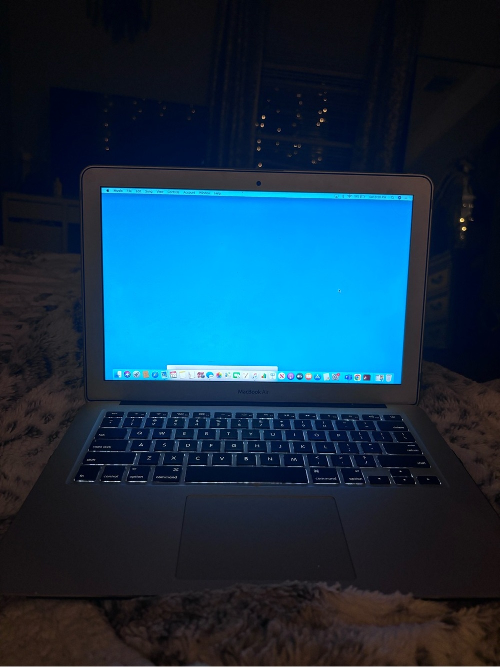 Apple MacBook Air Laptop in Silver with Blue Screen